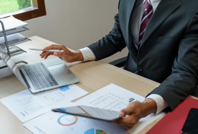 Business man working with laptop. Young business man thinking Concentrated at work