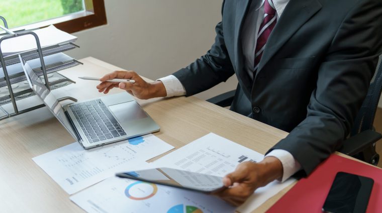 Business man working with laptop. Young business man thinking Concentrated at work